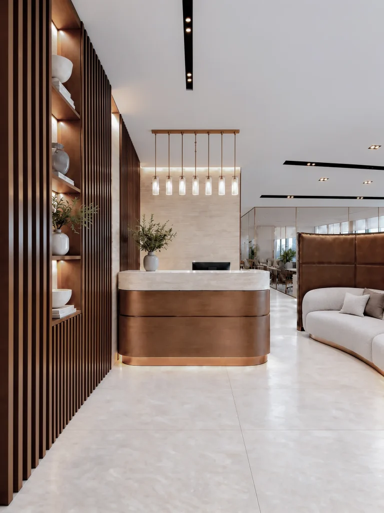 Reception desk in walnut and stone, a curved sofa beyond