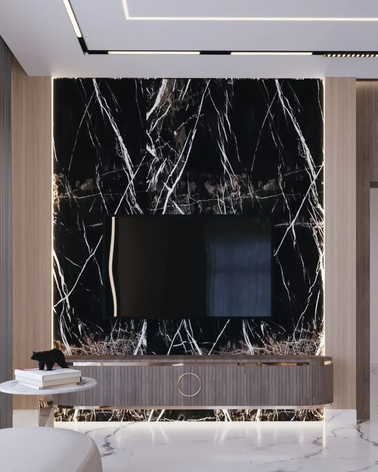 Majlis detail: book-matched black marble framing a concealed television