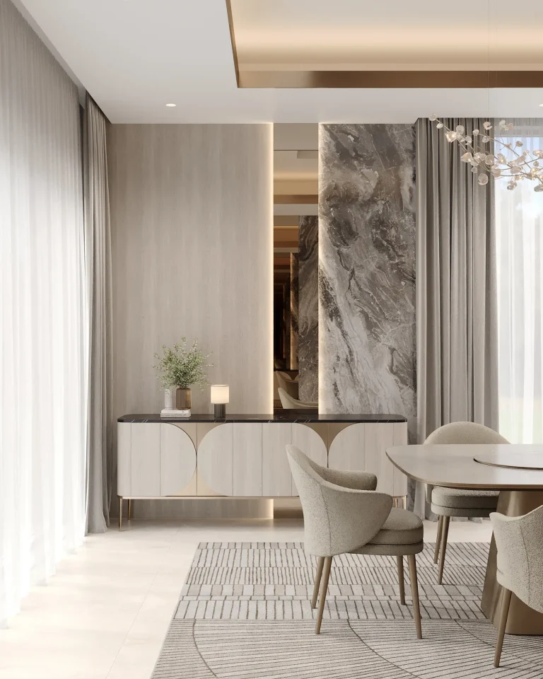 Dining room detail: a curved brass-trimmed console against book-matched stone