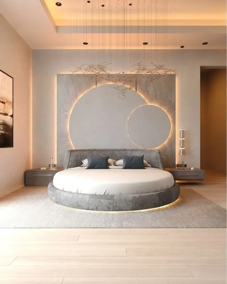 Principal bedroom with a circular bed and a backlit curved headboard wall