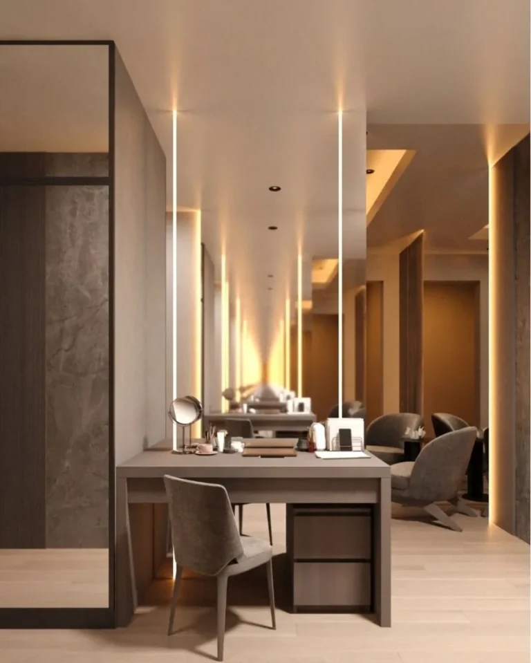 Study and vanity under a lit cove, mirrored to the dressing room