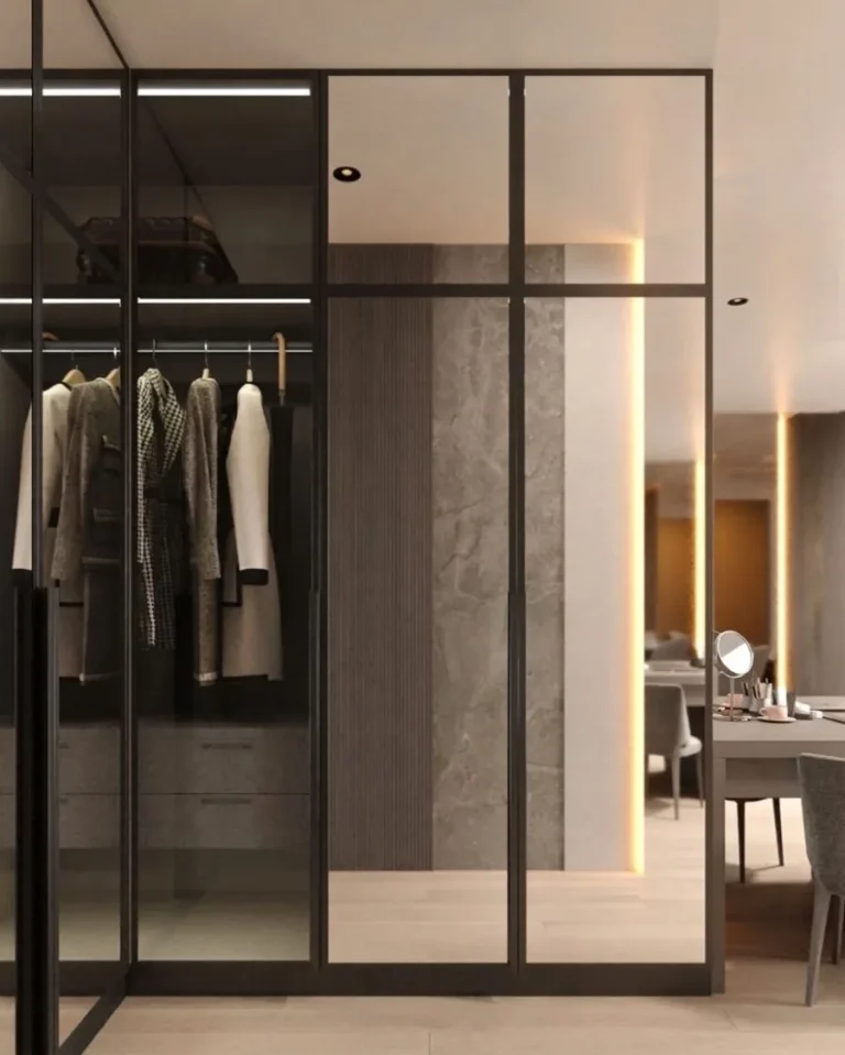 Walk-in wardrobe in framed glass with internal lighting